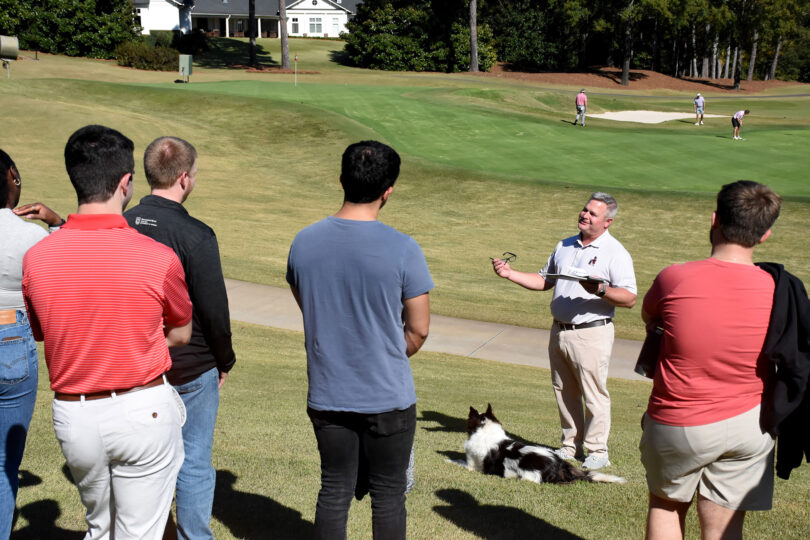 Scott Griffith speaking to group on the Golf Course green