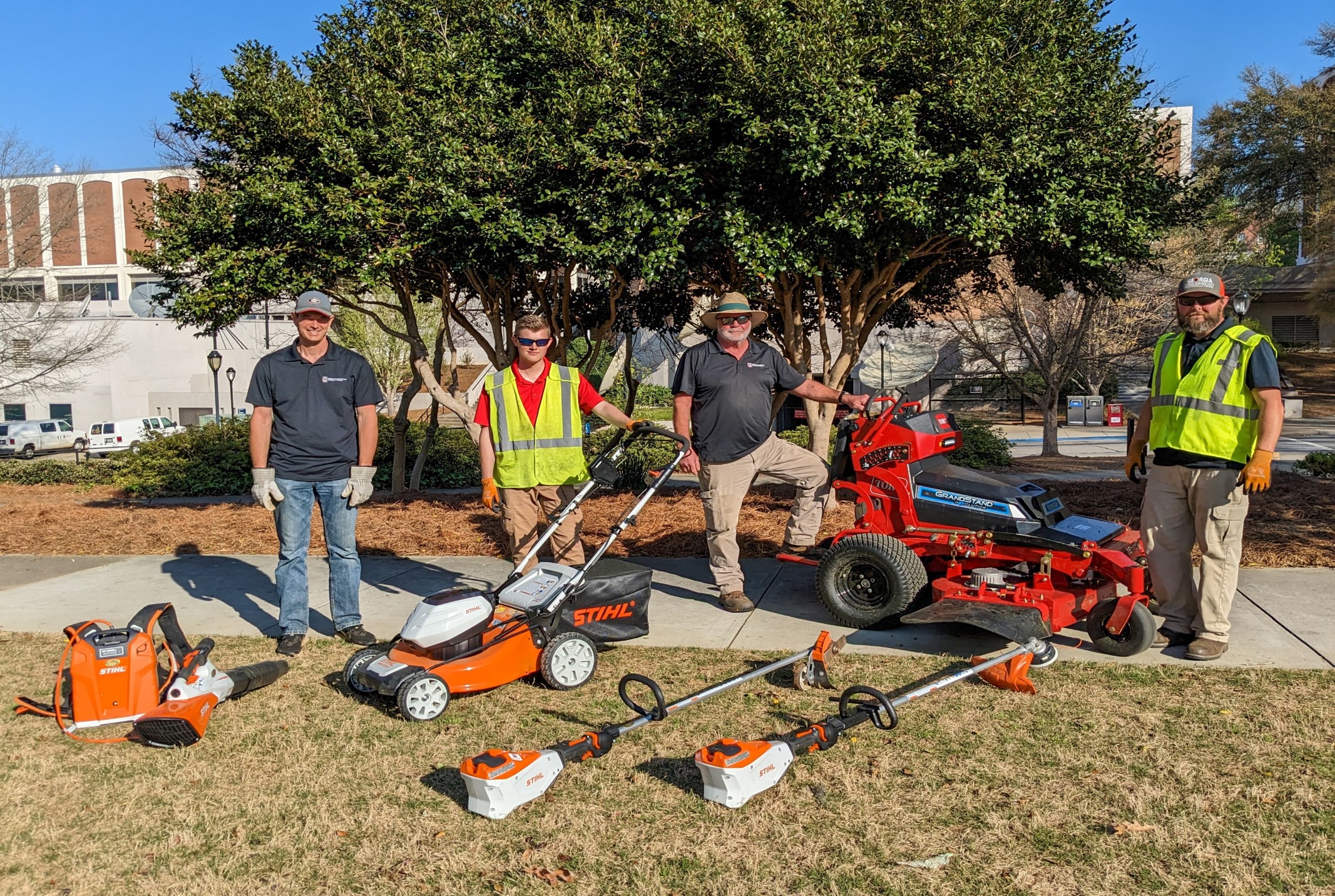 grounds crew with electric equipment