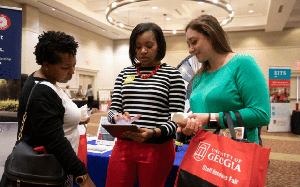 Three people at Resource Fair